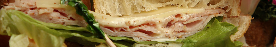 Eating Deli Kosher Sandwich at Larry's Lunchbox Delicatessen restaurant in Naples, FL.